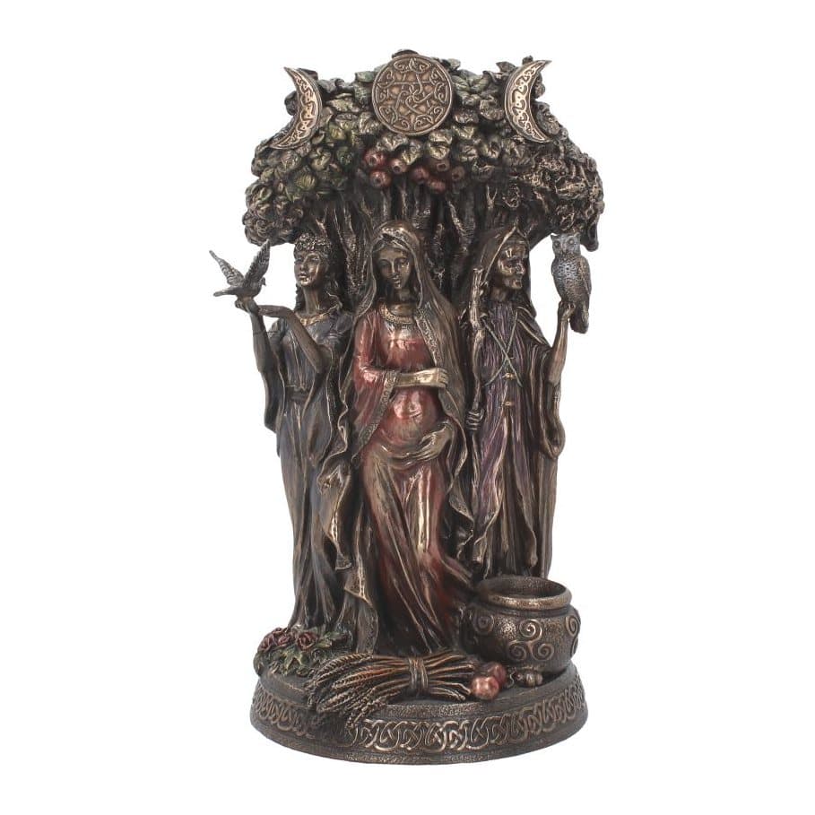 Bronze-finish statue of three robed women before a tree under three moons